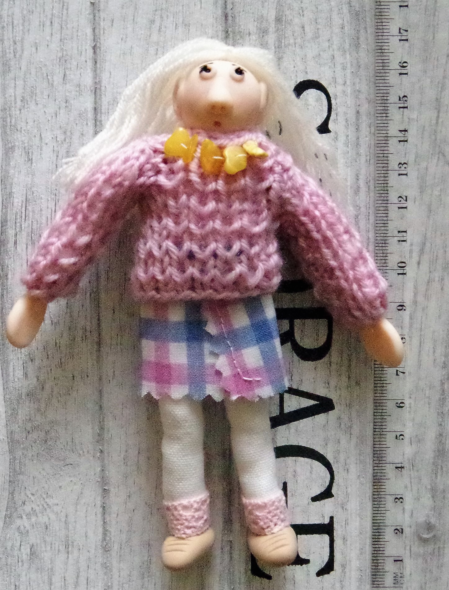 A rag doll 17 cm. With a head, hands and shoes made of modelling clay.